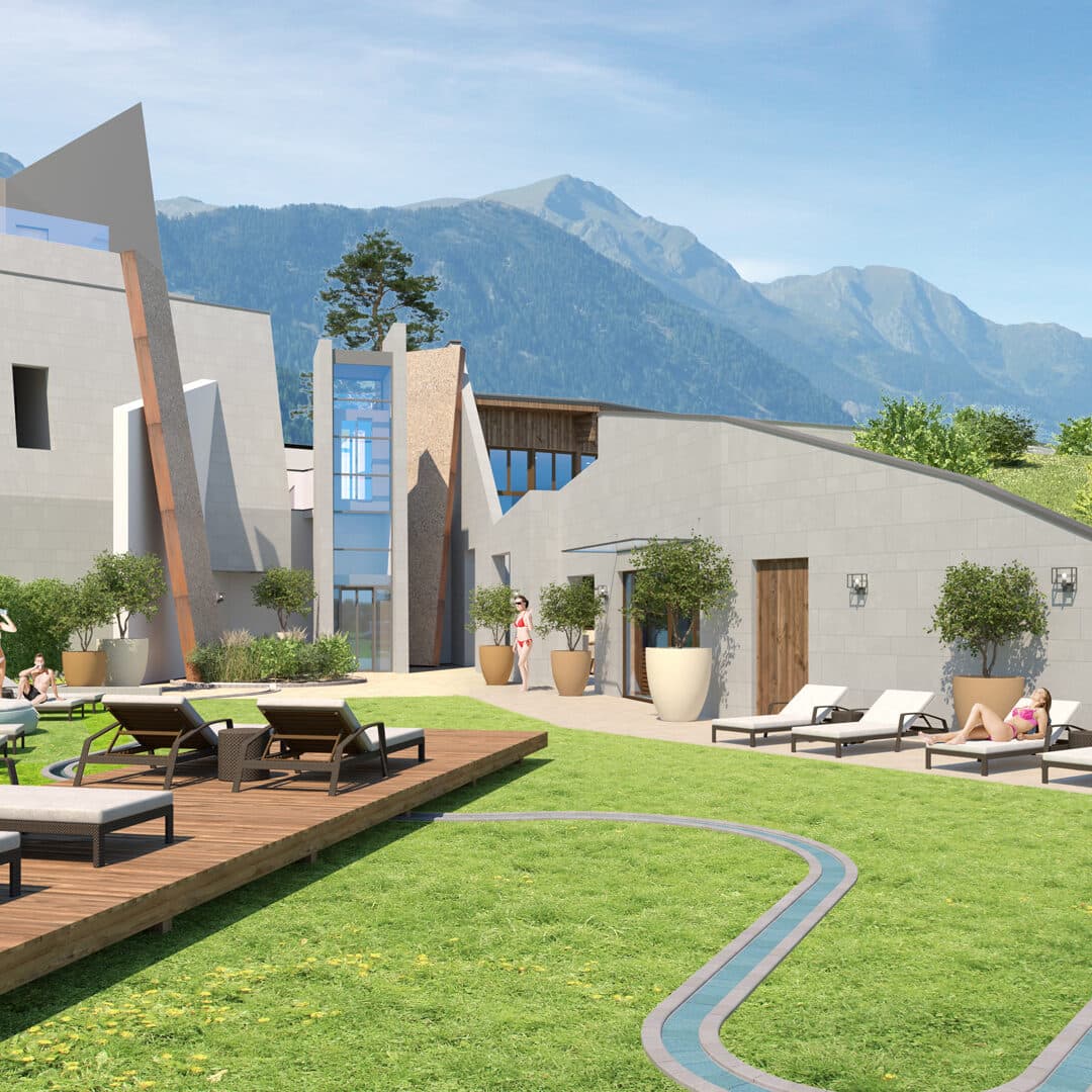 Moderner Lounge-Bereich im Freien mit Sonnenliegen, Grünflächen und zeitgenössischen Gebäuden vor der Kulisse der Berge unter einem klaren Himmel.